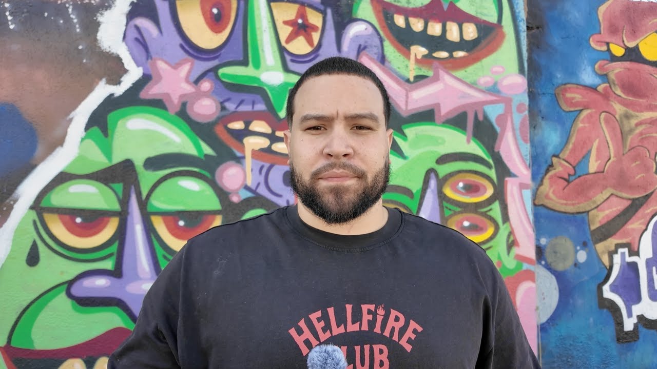 Before: original YouTube thumbnail with street art background and static pose